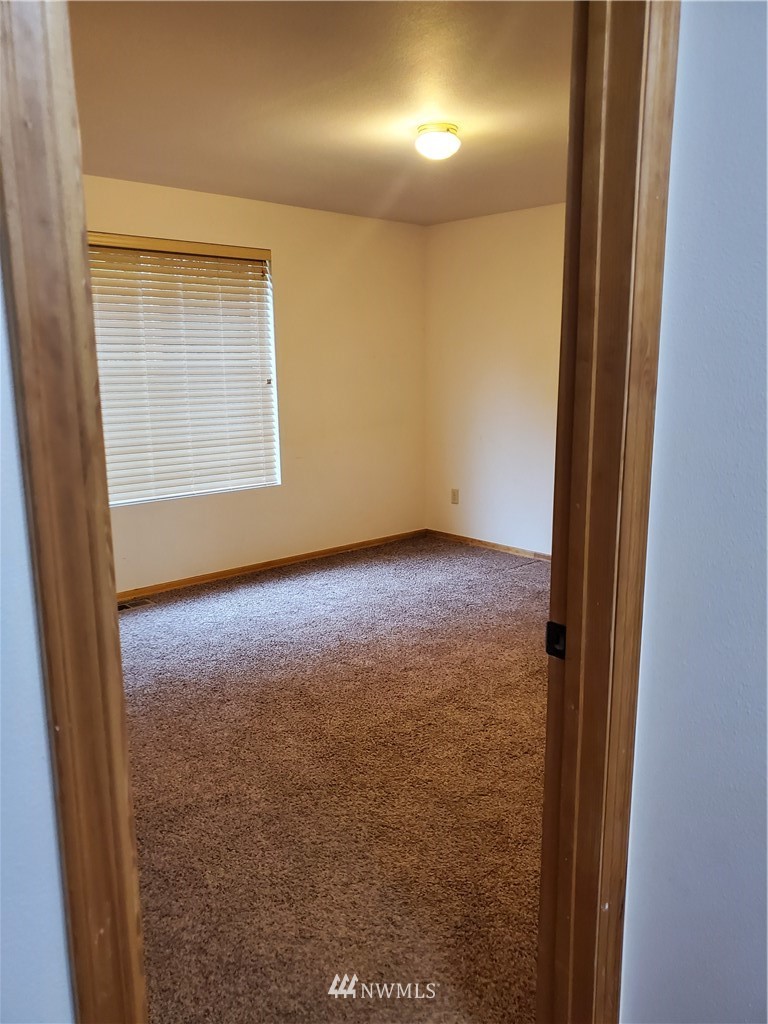 541 East Coulter Creek Road Belfair, WA 98528 - Photo 29 of 39 an empty room with windows