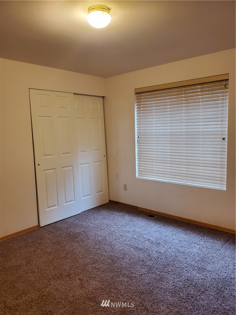 541 East Coulter Creek Road Belfair, WA 98528 - Photo 30 of 39 an empty room with windows