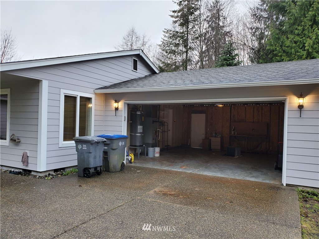 541 East Coulter Creek Road Belfair, WA 98528 - Photo 31 of 39 a couple of table and chairs in front of house