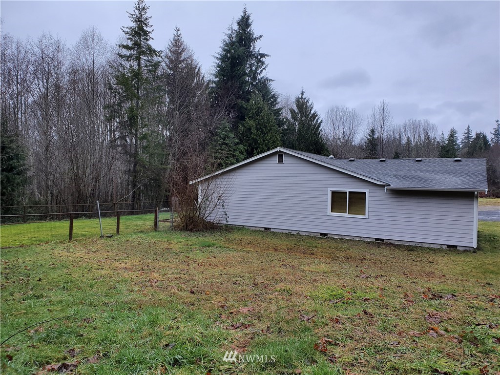541 East Coulter Creek Road Belfair, WA 98528 - Photo 35 of 39 a backyard of a house with lots of green space