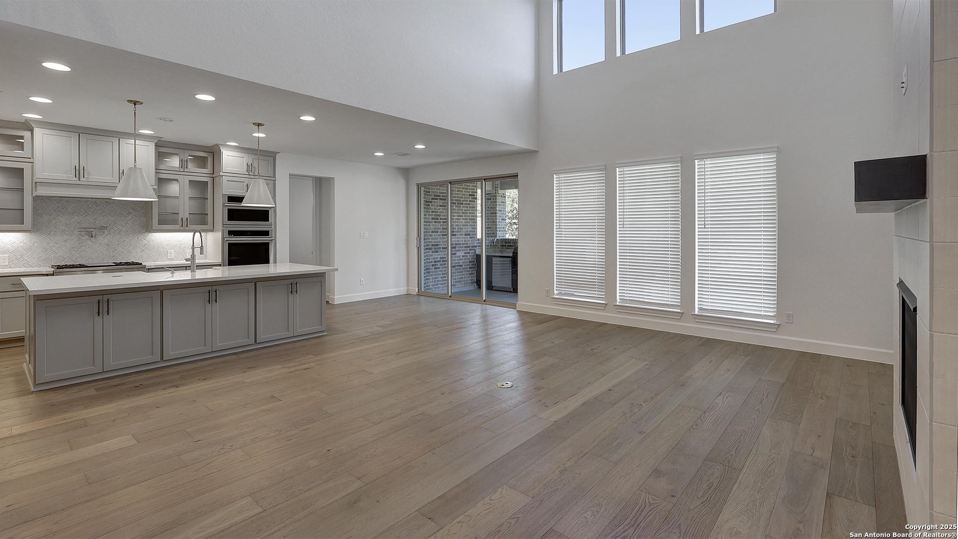 30 Enia Circle San Antonio, TX 78257 - Photo 11 of 27 a large kitchen with stainless steel appliances granite countertop a large counter top and a wooden floors