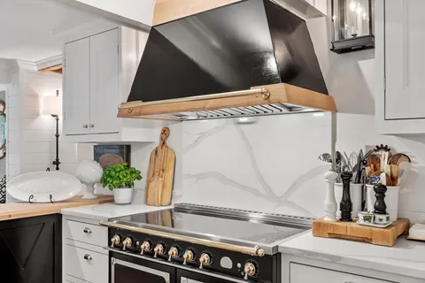 a kitchen with a sink and a stove