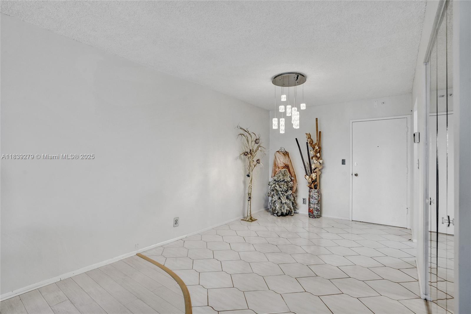 405 North Ocean Boulevard, Unit 815 Pompano Beach, FL 33062 - Photo 12 of 41 a view of a room with wooden floor