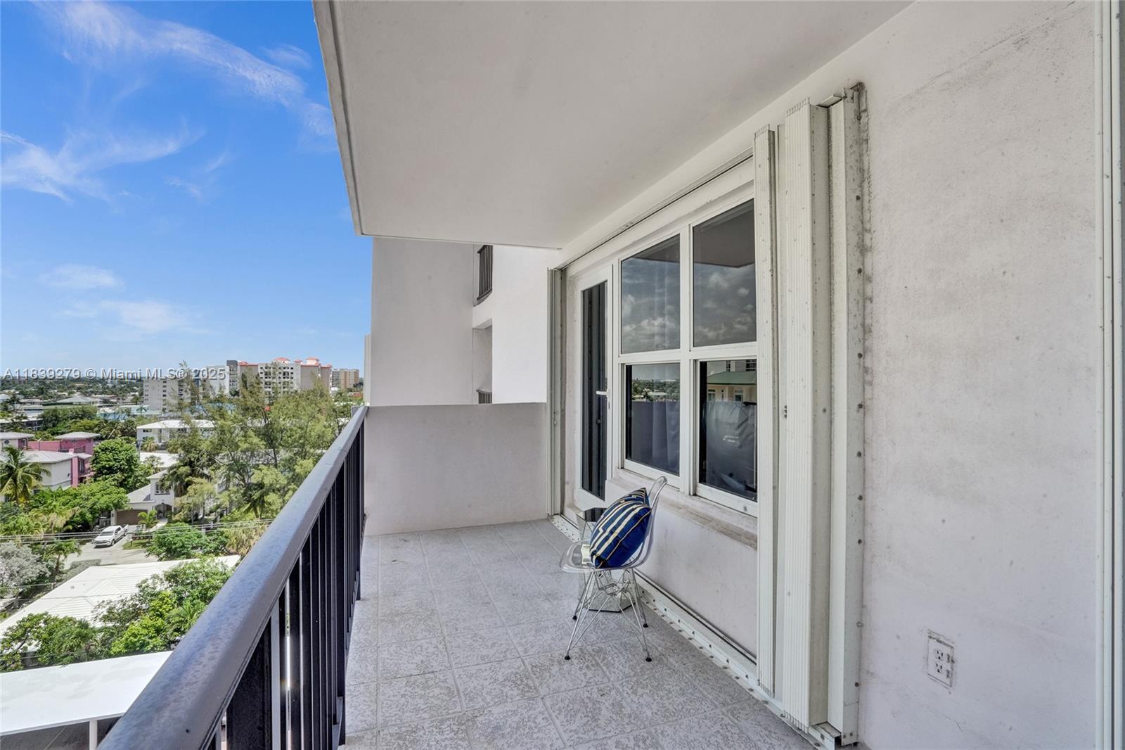 405 North Ocean Boulevard, Unit 815 Pompano Beach, FL 33062 - Photo 24 of 41 a view of a balcony with chair and front door