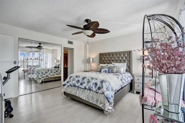 a view of building with palm trees