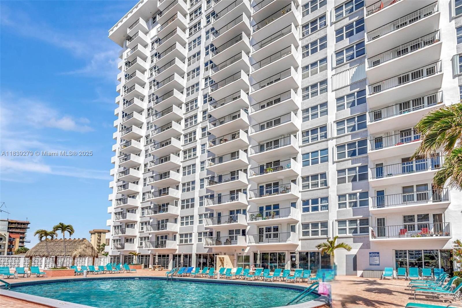 405 North Ocean Boulevard, Unit 815 Pompano Beach, FL 33062 - Photo 40 of 41 front view of a building with a yard