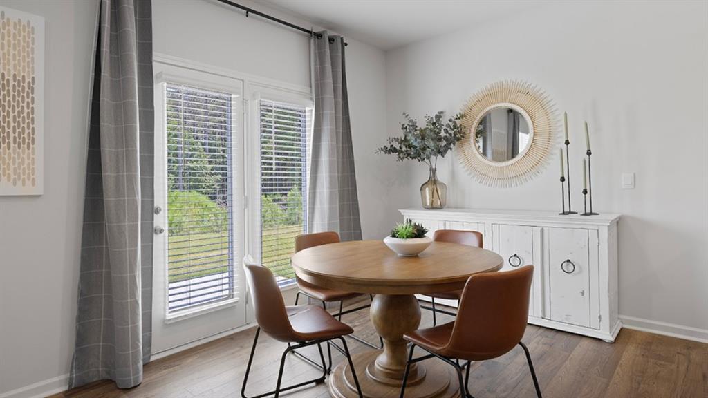 5541 Donamire Way Fairburn, GA 30213 - Photo 11 of 71 a view of a dining room with furniture and a window
