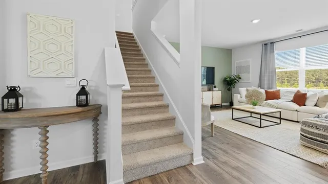 a bedroom with a bed and a night stand