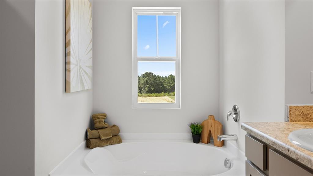 5541 Donamire Way Fairburn, GA 30213 - Photo 28 of 71 a bathroom with a sink and a window