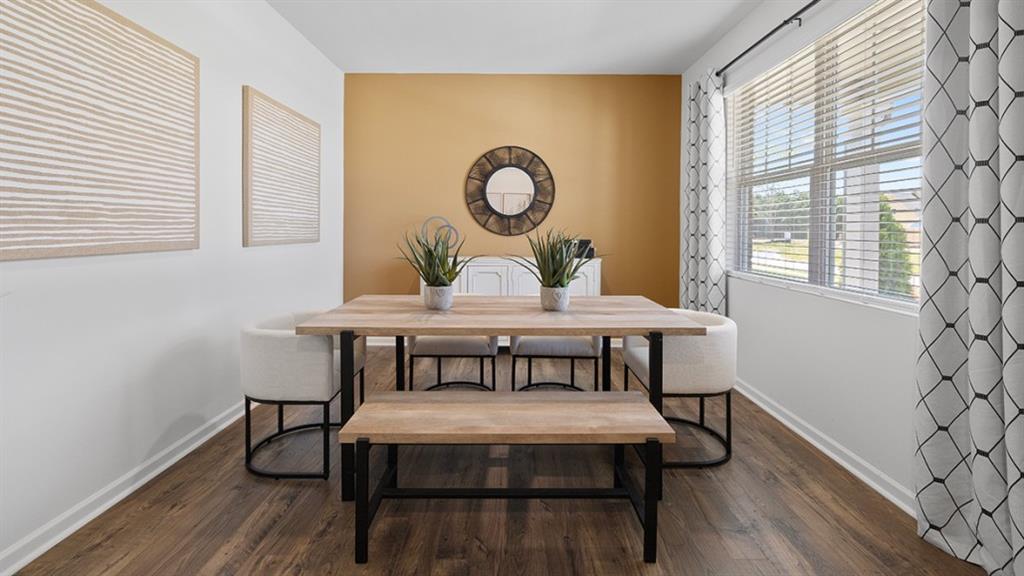 5541 Donamire Way Fairburn, GA 30213 - Photo 3 of 71 a view of a dining room with furniture and wooden floor
