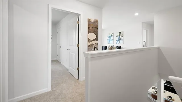 a bedroom with a bed and a lamp