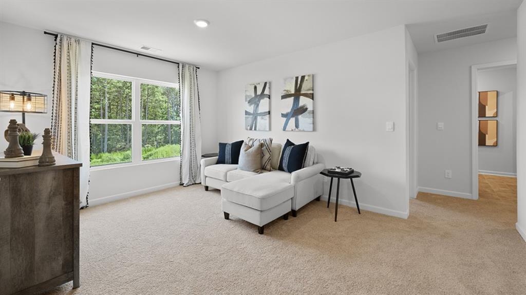 5541 Donamire Way Fairburn, GA 30213 - Photo 32 of 71 a living room with furniture and a large window