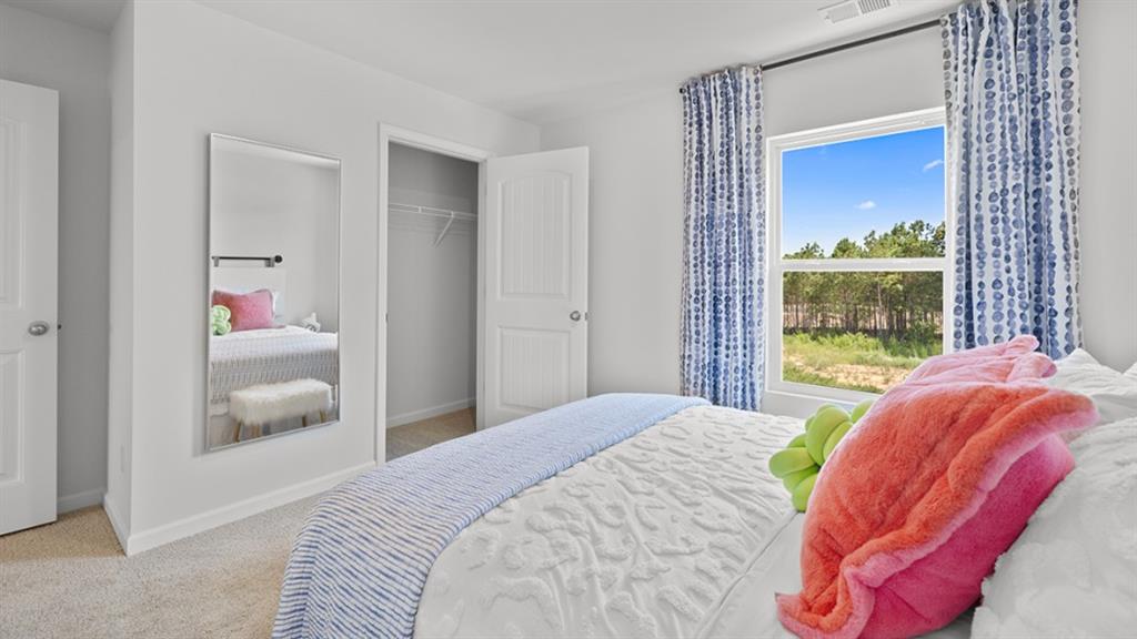 5541 Donamire Way Fairburn, GA 30213 - Photo 39 of 71 a bedroom with a bed and window