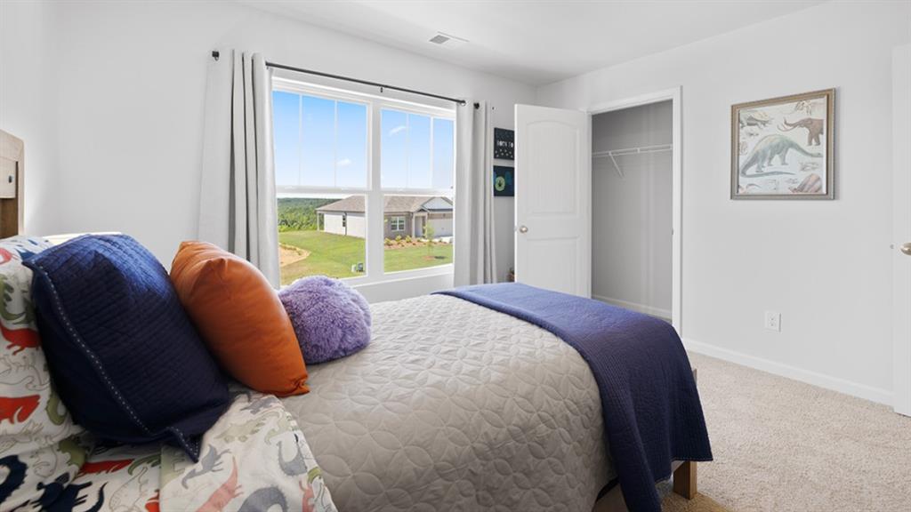 5541 Donamire Way Fairburn, GA 30213 - Photo 42 of 71 a bedroom with a bed and a window