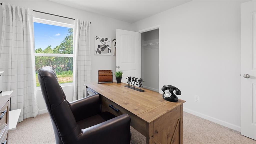 5541 Donamire Way Fairburn, GA 30213 - Photo 44 of 71 a view of a workspace with furniture and a window