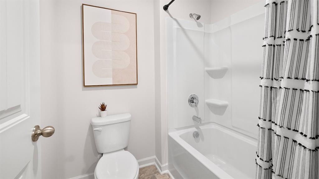 5541 Donamire Way Fairburn, GA 30213 - Photo 46 of 71 a bathroom with a sink a toilet and shower