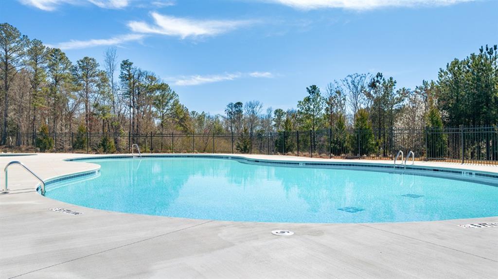 5541 Donamire Way Fairburn, GA 30213 - Photo 57 of 71 a view of a swimming pool and a yard