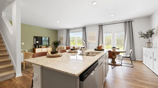 a view of a dining room with furniture and a window