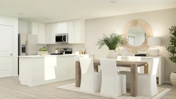 a kitchen with stainless steel appliances granite countertop a white cabinets a stove a sink and a refrigerator