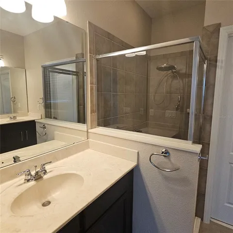 a bathroom with a sink and mirror