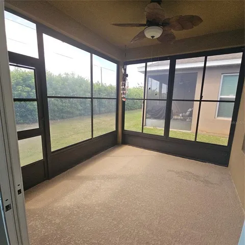a view of an empty room with a large window