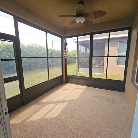 a view of an empty room with a large window