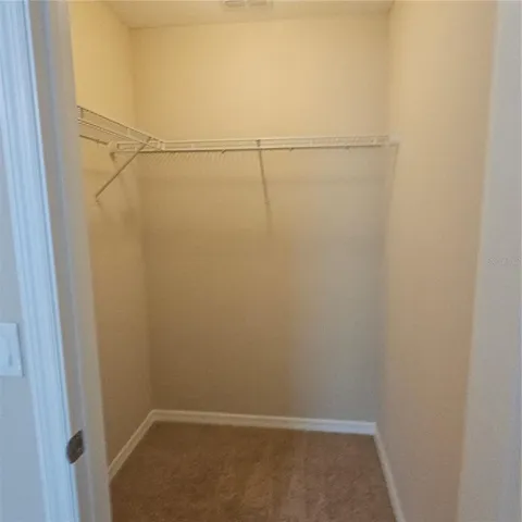 a bathroom with a sink a light fixture and a mirror