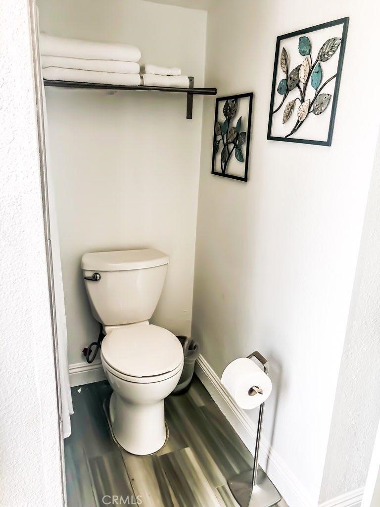 214 Walnut Avenue Huntington Beach, CA 92648 - Photo 2 of 14 a white toilet sitting next to a white toilet