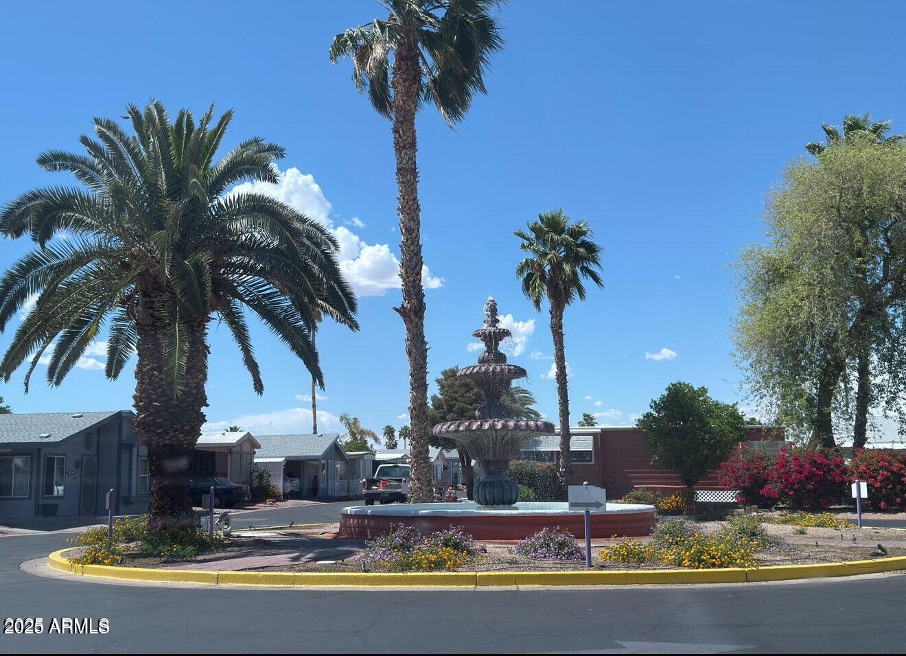 8865 East Baseline Road, Unit 614 Mesa, AZ 85209 - Photo 15 of 15 a view of a house with swimming pool and a trees