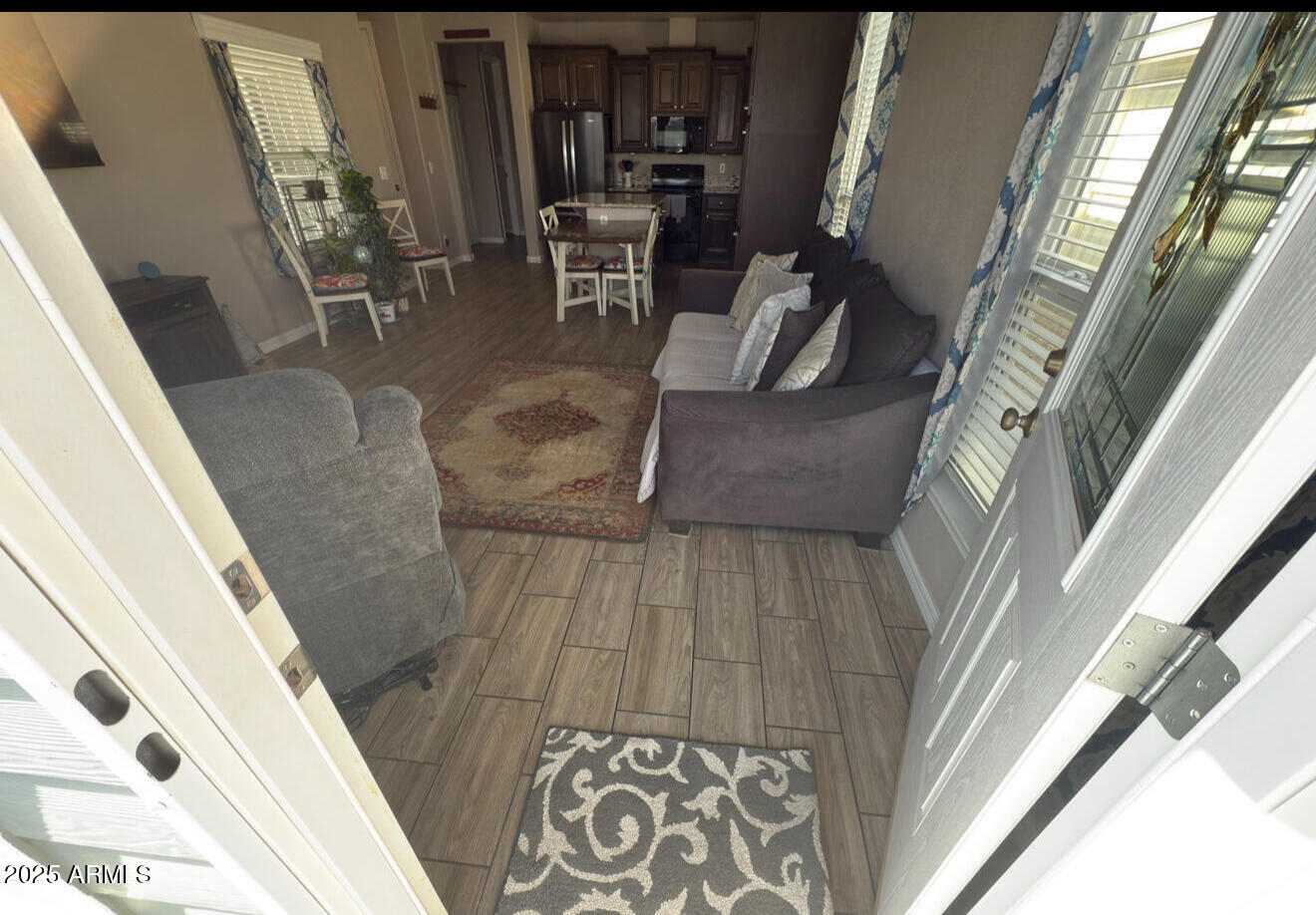 8865 East Baseline Road, Unit 614 Mesa, AZ 85209 - Photo 3 of 15 a view of living room with furniture and a fireplace
