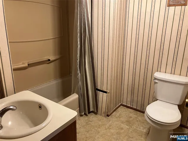 a bathroom with a toilet and a sink