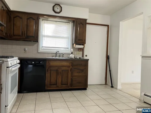 a kitchen with a sink and a refrigerator