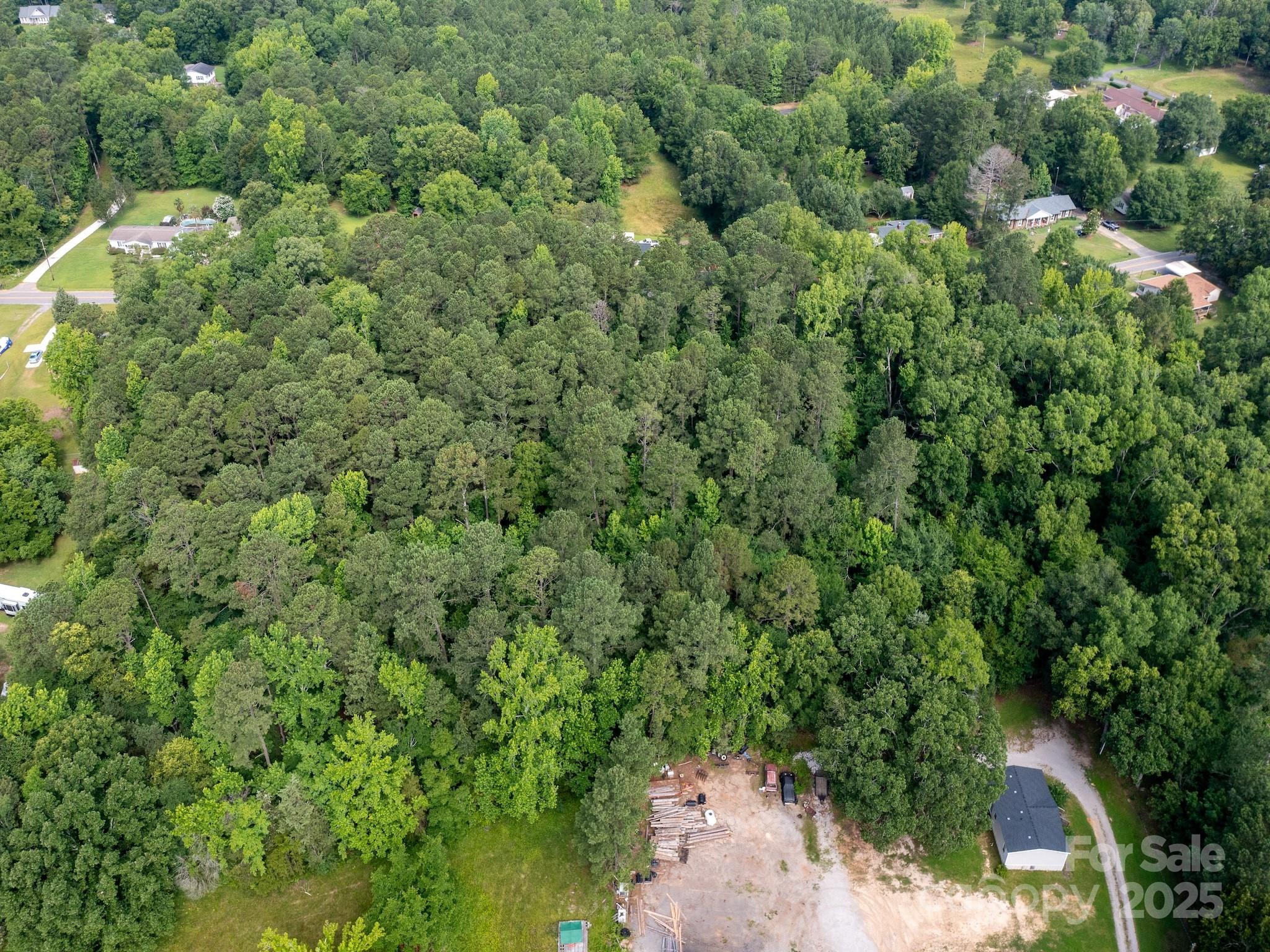 0 Powell Avenue Lancaster, SC 29720 - Photo 11 of 26 an aerial view of residential house with outdoor space and trees all around