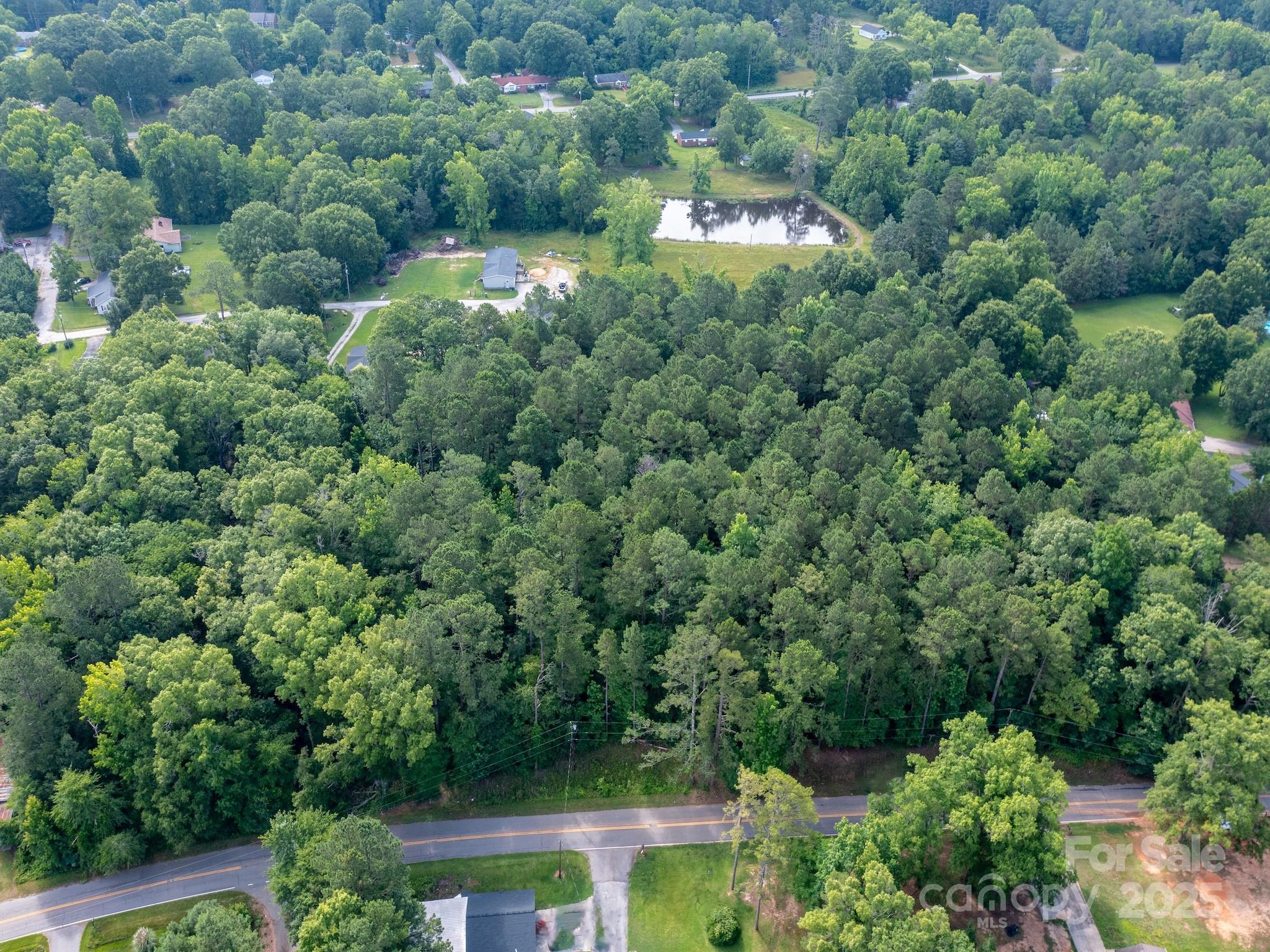 0 Powell Avenue Lancaster, SC 29720 - Photo 9 of 26 an aerial view of residential house with outdoor space and trees all around