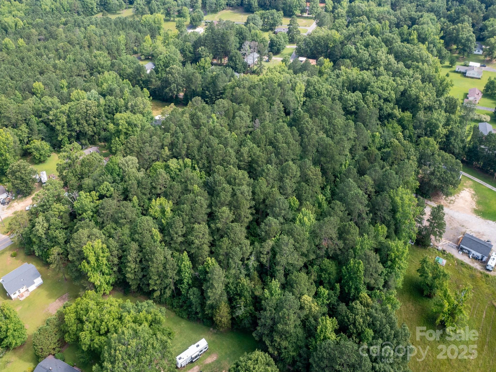 0 Powell Avenue Lancaster, SC 29720 - Photo 10 of 26 an aerial view of residential house with outdoor space and trees all around