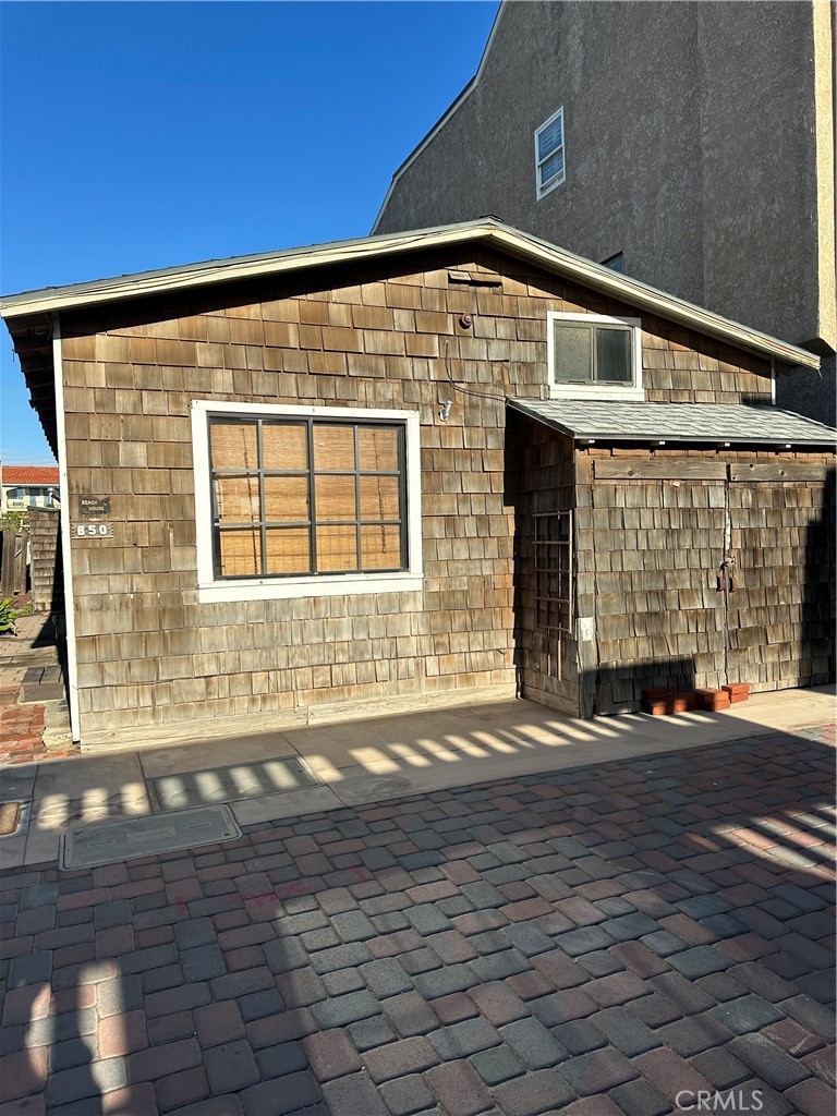 50 Surfside Avenue, Unit B Huntington Beach, CA 92649 - Photo 1 of 2 a front view of a house