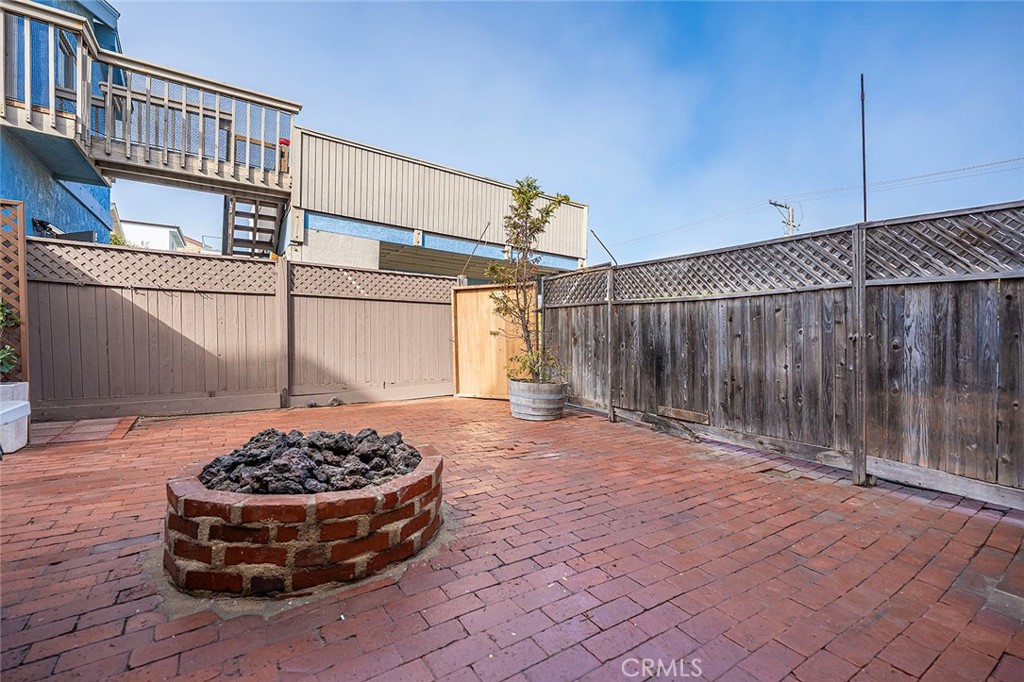 50 B Surfside Avenue, Unit B Surfside, CA 92649 - Photo 27 of 34 Large backyard with firepit