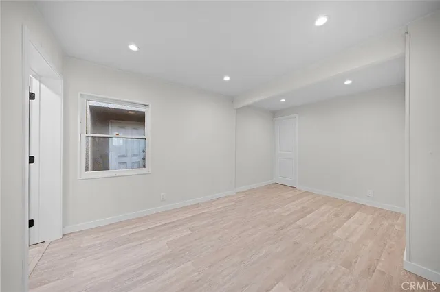 a view of hallway with wooden floor