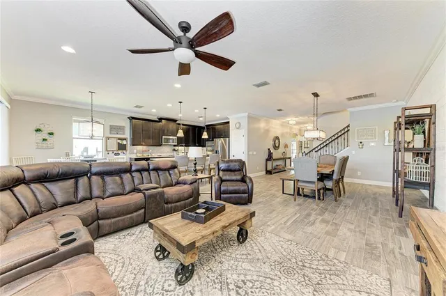 a large kitchen with lots of counter space a sink appliances and cabinets