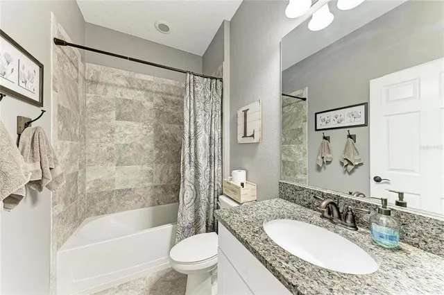 a kitchen with a sink a stove and cabinets