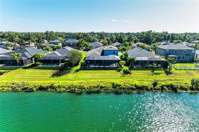a view of an houses with swimming pool and outdoor space