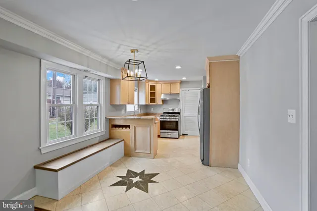 a room with white cabinets and outdoor space