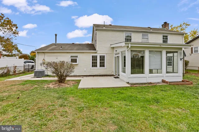a view of a house with a yard and plants