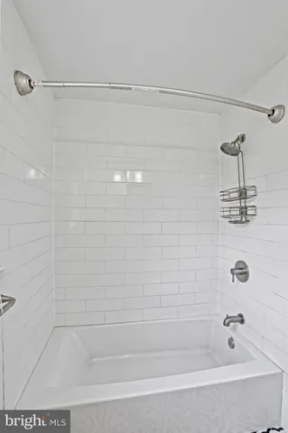 a bathroom with a shower and a bathtub