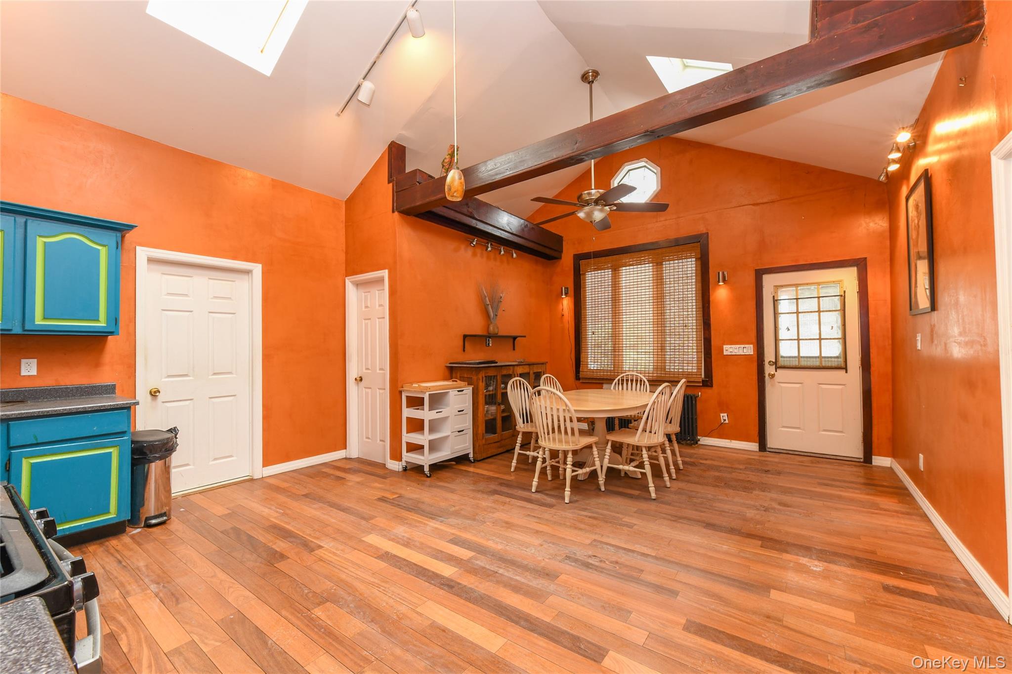 76-43 85th Road Queens, NY 11421 - Photo 18 of 31 a dining room with furniture and wooden floor