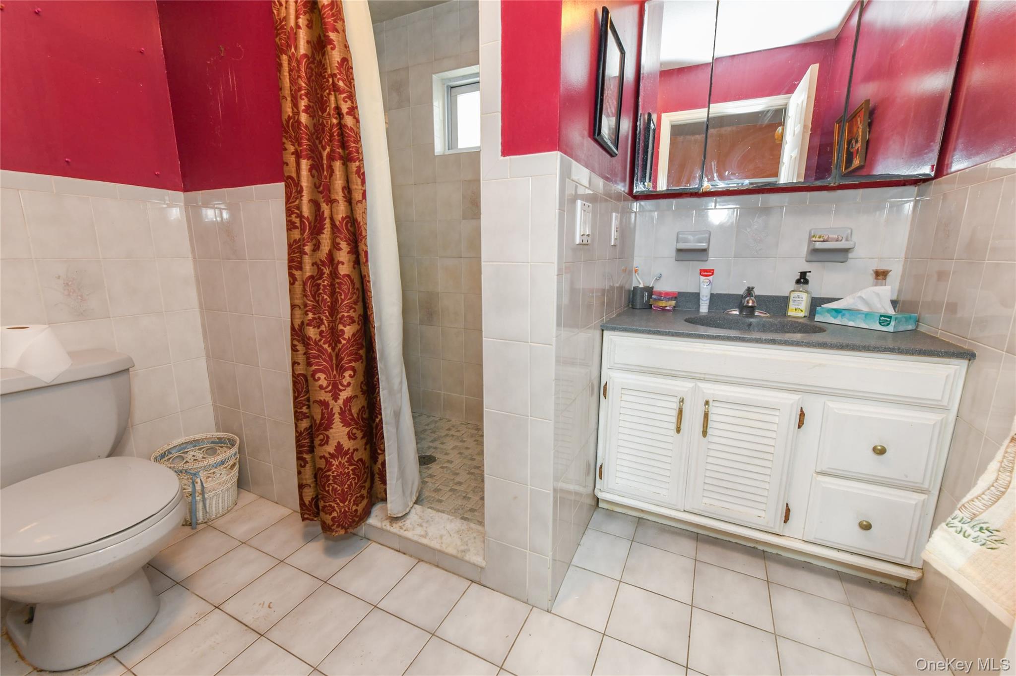 76-43 85th Road Queens, NY 11421 - Photo 30 of 31 a bathroom with a toilet sink and shower