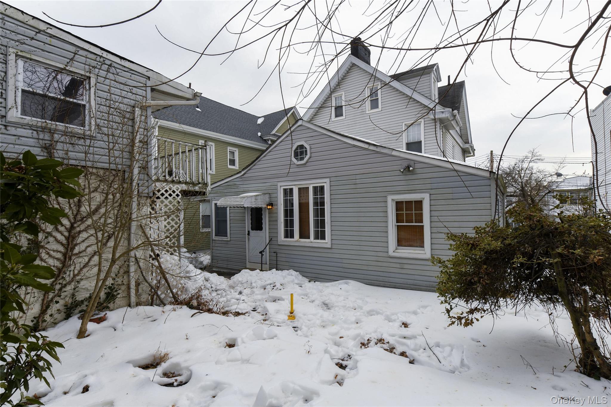 76-43 85th Road Queens, NY 11421 - Photo 5 of 31 a view of a house covered in snow