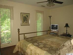 17 Catawba Ridge Road Lake Wylie, SC 29710 - Photo 13 of 16 a bedroom with a bed and a window