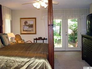 17 Catawba Ridge Road Lake Wylie, SC 29710 - Photo 10 of 16 a bed sitting in a bedroom next to a window