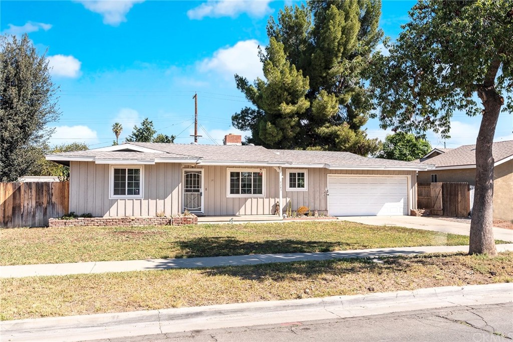 4285 Royce Street Riverside, CA 92503 - Photo 1 of 1 a front view of a house with a yard